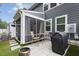 Relaxing screened patio with comfortable seating and outdoor grilling area at 273 Millennium Dr, Pittsboro, NC 27312