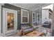 Cozy screened porch with comfortable seating, offering a relaxed outdoor space at 273 Millennium Dr, Pittsboro, NC 27312