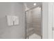 Contemporary tiled shower with glass door, built-in bench, and modern fixtures at 273 Millennium Dr, Pittsboro, NC 27312