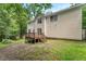 Backyard view of the two-story home with a wood deck, siding, and lawn at 2750 Michelle Ct, Creedmoor, NC 27522