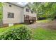 Exterior side view of the home with the wood deck, siding, and lawn at 2750 Michelle Ct, Creedmoor, NC 27522