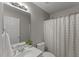 Bathroom with single sink vanity and shower with shower curtain at 2750 Michelle Ct, Creedmoor, NC 27522
