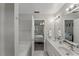 A bathroom view including a tub and vanity with the bedroom as a backdrop at 2750 Michelle Ct, Creedmoor, NC 27522