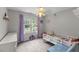 bedroom featuring carpet, bright window, light fan, and multiple decorations at 2750 Michelle Ct, Creedmoor, NC 27522