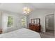 Bright primary bedroom featuring vaulted ceilings, ceiling fan, and large windows at 2750 Michelle Ct, Creedmoor, NC 27522