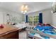 ' bedroom with bunk beds, ceiling fan, and a large window for lots of natural light at 2750 Michelle Ct, Creedmoor, NC 27522