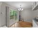 Cozy dining area with sliding glass doors to a deck and modern chandelier at 2750 Michelle Ct, Creedmoor, NC 27522