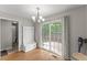 Bright dining area with door to backyard, chandelier, and natural light at 2750 Michelle Ct, Creedmoor, NC 27522