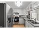 Modern kitchen featuring stainless steel appliances and white cabinets at 2750 Michelle Ct, Creedmoor, NC 27522
