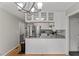 Stylish kitchen with gray countertops, white cabinetry and stainless steel appliances at 2750 Michelle Ct, Creedmoor, NC 27522