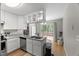Efficient kitchen layout with stainless steel appliances and ample counter space next to dining area at 2750 Michelle Ct, Creedmoor, NC 27522