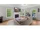 Bright living room featuring a fireplace, hardwood floors, and plenty of natural light at 2750 Michelle Ct, Creedmoor, NC 27522