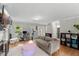 Spacious living room featuring hardwood floors, large windows, and neutral decor for versatile styling at 2750 Michelle Ct, Creedmoor, NC 27522