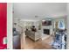 Bright living room with hardwood floors, a fireplace, and large windows overlooking the backyard at 2750 Michelle Ct, Creedmoor, NC 27522