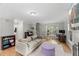Open living room with hardwood floors, gray walls, and a cozy seating area at 2750 Michelle Ct, Creedmoor, NC 27522