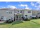 A view of the backyard with a screened in porch, green grass, and neutral colored siding at 287 White Oak Ridge Dr, Garner, NC 27529