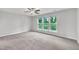 Bright bedroom with carpet flooring, triple windows, and a ceiling fan offers a relaxing atmosphere at 287 White Oak Ridge Dr, Garner, NC 27529