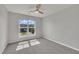Neutral bedroom with a window providing an exterior view of the property at 287 White Oak Ridge Dr, Garner, NC 27529
