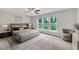Bedroom with windows overlooking a picturesque outdoor scene, offering natural light and a serene ambiance at 287 White Oak Ridge Dr, Garner, NC 27529