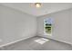 Neutral bedroom with a bright window offering a pleasant view of the outdoors at 287 White Oak Ridge Dr, Garner, NC 27529