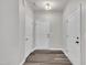 Bright foyer with hardwood floors, neutral walls, and multiple white doors at 287 White Oak Ridge Dr, Garner, NC 27529