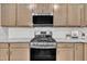 Modern kitchen showcases stainless steel appliances, granite counters, and sleek cabinetry for a contemporary feel at 287 White Oak Ridge Dr, Garner, NC 27529