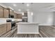 Stylish kitchen with stainless steel appliances, granite countertops, and a center island for culinary enjoyment at 287 White Oak Ridge Dr, Garner, NC 27529
