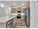 Bright kitchen featuring stainless steel appliances, granite countertops, and stylish cabinetry for cooking convenience at 287 White Oak Ridge Dr, Garner, NC 27529