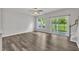 Bright living room featuring beautiful hardwood floors and sliding glass doors to let in natural light at 287 White Oak Ridge Dr, Garner, NC 27529