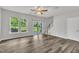 Bright living room features a sliding glass door with a view of the yard and a staircase to the second floor at 287 White Oak Ridge Dr, Garner, NC 27529