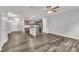 Open-concept living room flows into kitchen with stainless appliances and center island with hard wood flooring at 287 White Oak Ridge Dr, Garner, NC 27529