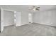 Spacious primary bedroom with a view into the ensuite bathroom offers an open floor plan and carpeted floors at 287 White Oak Ridge Dr, Garner, NC 27529