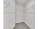 Spacious walk-in closet featuring wrapped wire shelving and neutral carpet flooring at 287 White Oak Ridge Dr, Garner, NC 27529
