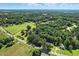 Beautiful aerial view of 3005 Piney Grove Wilbon Rd surrounded by lush greenery at 3005 Piney Grove Wilbon Rd, Holly Springs, NC 27540