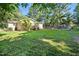 Large grassy backyard, fenced, trees, patio, exterior view of home at 3005 Piney Grove Wilbon Rd, Holly Springs, NC 27540