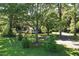 Landscaped home featuring mature trees and an expansive lawn at 3005 Piney Grove Wilbon Rd, Holly Springs, NC 27540