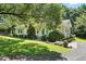 A well-maintained house with pretty landscaping and a healthy green lawn at 3005 Piney Grove Wilbon Rd, Holly Springs, NC 27540