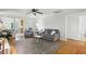 An airy living room filled with natural light and ample seating at 3005 Piney Grove Wilbon Rd, Holly Springs, NC 27540