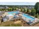 Aerial view of the community pools, amenities, and surrounding residential area on a sunny day at 3058 Hyco Lake Ct, Fuquay Varina, NC 27526