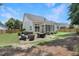 Well-maintained backyard with patio, barbecue grill, and lush landscaping for outdoor enjoyment at 3058 Hyco Lake Ct, Fuquay Varina, NC 27526