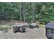 Inviting backyard patio with outdoor seating, grilling area, and a serene, wooded view at 3058 Hyco Lake Ct, Fuquay Varina, NC 27526
