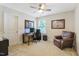 Bedroom featuring a work station with dual monitors, art on the walls and a comfy leather chair in the corner at 3058 Hyco Lake Ct, Fuquay Varina, NC 27526