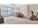 Finished bonus room includes a comfortable seating area and a stationary bike at 3058 Hyco Lake Ct, Fuquay Varina, NC 27526