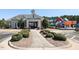 Community center and playground area surrounded by manicured landscaping and ample parking at 3058 Hyco Lake Ct, Fuquay Varina, NC 27526