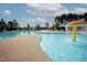 Community pool with water features, lounge chairs, and clear blue water, perfect for recreation at 3058 Hyco Lake Ct, Fuquay Varina, NC 27526