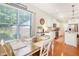 Bright dining area features a breakfast nook and white cabinets and trim at 3058 Hyco Lake Ct, Fuquay Varina, NC 27526