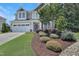 Well-maintained home with landscaped front yard, attached garage, and charming curb appeal at 3058 Hyco Lake Ct, Fuquay Varina, NC 27526