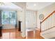 Inviting foyer with hardwood floors, staircase, and views into a bright front room at 3058 Hyco Lake Ct, Fuquay Varina, NC 27526