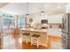 Bright eat-in kitchen featuring granite countertops, stainless appliances, and a breakfast nook with ample natural light at 3058 Hyco Lake Ct, Fuquay Varina, NC 27526