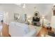 Spacious living room with ample seating, natural light, and hardwood floors at 3058 Hyco Lake Ct, Fuquay Varina, NC 27526